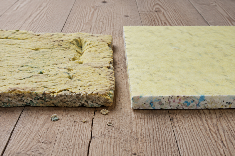 Worn, compressed carpet underlay beside a fresh piece with intact yellow facing and an even foam edge.